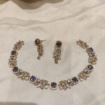 Scintillating Leafs Necklace With Blue AD Stone