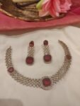 Trendsetting Crystal Neckalce With Red Ad Stone