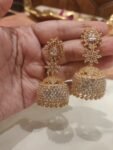 Poised Golden  Jhumka With Crystal Floral design