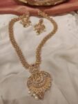 Alluring Floral Long Lakshmi Necklace With White Pearl
