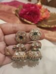 Inimitable Crystal Floral Jhumka With Green AD Stone