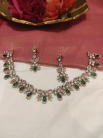 Jubilant Crystal White Moti Pearl Short AD Necklace with Green AD Stone