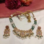 Resplendent Handcarfted Peacock Elephant Choker With White Beads