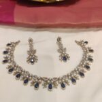 Jubilant Crystal White Moti Pearl Short AD Necklace with Blue AD Stone