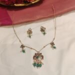 Lustrous Golden Chain With  Peacock Pendant Light Green White Beads