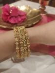 Radiant Red Green Crystal AD Stone Lakshmi  Bangles Set of 4