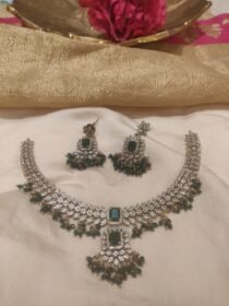 Trendsetting CZ Floral Necklace With Green Ad Stone