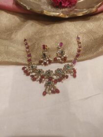 Trendsetting Red AD Stone Floral Necklace with Red Beads