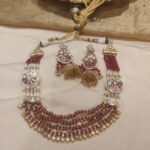 Opulent bridal blood red moti and golden necklace