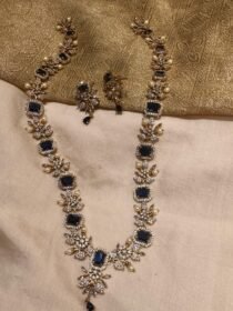 Lustrous deep ocean stone with diamond necklace