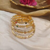 Radiant multi stone on golden kada