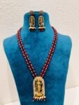 Scintillating Grand Ethereal god golden pendant with red bds necklace
