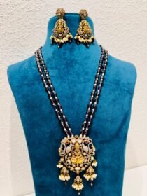 Resplendent Enigmatic godess golden pendant with red bds bridal necklace