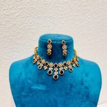 Artisanal brown stone droplet with ad diamond leaf choker