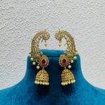Grand sea horse design with pearls and ruby stone jhumka earring