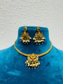 Whimisical golden half moon with pearls and purple bids golden necklace