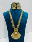 Brilliant Alluring golden haar with green bids golden pendant bridal necklace