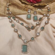 Elegant Dazzling sky blue  stone with ad stone golden necklace
