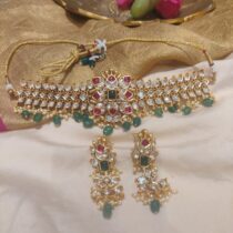 Timeless kundan  ad stone with ruby and green bids choker necklace