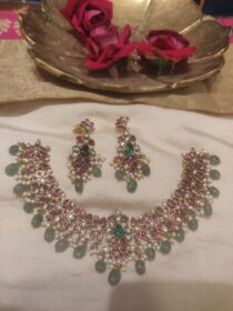 Alluring Floral Ruby Stone Necklace With Lightgreen Beads