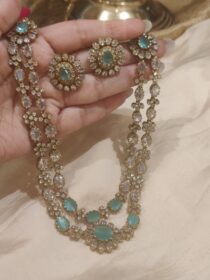 Lustrous 2 Layer Floral Necklace With Skyblue Ad Stone