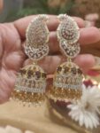 Mesmerizing CZ Leafy Jhumka With Purple AD Stone