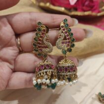 Dazzling Peacock Jhumka With Green White Beads