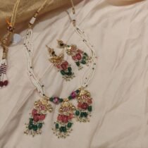 Radiant Handcrafted Multilayer White Beads Necklace With Red Green Droplet Beads