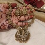 Lustrous Temple Necklace With Golden Beads