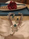 Regal Kundan Necklace Set with Emerald Green & Ruby Accents