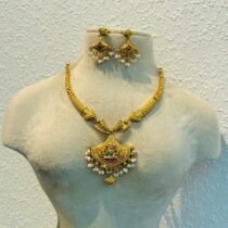 Radiant Golden Lakshmi Necklace with White Beads